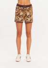 THE UPSIDE women's floral organic cotton Copacabana Leon Knit Short features a soft and supportive fit, side stripes, zip pockets and a drawcord waistband. Made for lifestyle.