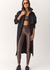 THE UPSIDE women's geo recycled supersoft Poet 25inch Midi Legging features a soft and supportive fit, mid rise waist, adjustable drawcord and signature geo print. Made for yoga and pilates.