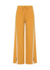THE UPSIDE women's yellow organic cotton Bonito Moby Knit Pant is designed for a soft and supportive fit and features a high rise waist, side stripe detailing and adjustable drawcord. Made for lifestyle.