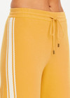 THE UPSIDE women's yellow organic cotton Bonito Moby Knit Pant is designed for a soft and supportive fit and features a high rise waist, side stripe detailing and adjustable drawcord. Made for lifestyle.