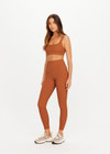 THE UPSIDE women’s brown recycled jacquard Mariana Bridie Sports Bra is designed for a soft, supportive fit and features removable cups and textured fabrication. Made for yoga and pilates.