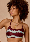 THE UPSIDE women’s tie dye recycled Rio Badu Crossback Sports Bra is a soft and supportive and features a scooped neckline, crossback straps and removable cups. Made for yoga and pilates.