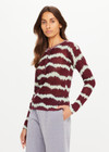 THE UPSIDE women’s tie dye 100% linen Rio Eli Long Sleeve Knit is a regular fit crew neck top and features a lightweight knit fabrication, button front opening and ribbed neckline. Made for lifestyle.