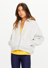 THE UPSIDE women’s grey marle organic cotton Jude Crop Hoodie offers an oversized fit and features a zip through front, hood with drawcord and ribbed cuffs and hem. Made for lifestyle.