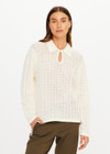 THE UPSIDE women's cream organic cotton Frederica Knit Top is designed for a relaxed fit with an open geometric knit construction, collared neckline and abalone shell button detailing. Made for lifestyle.