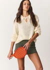 THE UPSIDE women's cream organic cotton Frederica Knit Top is designed for a relaxed fit with an open geometric knit construction, collared neckline and abalone shell button detailing. Made for lifestyle.