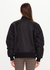 THE UPSIDE women's black Tribute Bomber Jacket is a true to size fit and features a classic bomber silhouette, ribbed trims, ruched sleeves and multiple functional pockets. Made for lifestyle.
