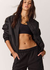 THE UPSIDE women's black Tribute Bomber Jacket is a true to size fit and features a classic bomber silhouette, ribbed trims, ruched sleeves and multiple functional pockets. Made for lifestyle.
