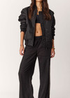 THE UPSIDE women's black Tribute Bomber Jacket is a true to size fit and features a classic bomber silhouette, ribbed trims, ruched sleeves and multiple functional pockets. Made for lifestyle.