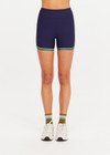 THE UPSIDE women's navy Rhythm 4inch Spin Short is a supportive and comfortable fit and features a mid rise waist, no front seam and contrast side binding. Made for yoga and pilates.