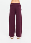 THE UPSIDE women's plum organic cotton Pele Estelle Pant is designed for a relaxed fit and features a wide leg barrel silhouette, elasticated waistband and contrast drawcord detailing. Made for lifestyle.