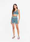 THE UPSIDE women's green Seamless 4inch Spin Short is designed for a supportive and comfortable fit and features a mid rise waist, seamless construction and ribbed striped waistband detailing. Made for yoga and pilates.