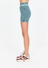 THE UPSIDE women's green Seamless 4inch Spin Short is designed for a supportive and comfortable fit and features a mid rise waist, seamless construction and ribbed striped waistband detailing. Made for yoga and pilates.