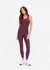 THE UPSIDE women's plum Pele Sophie Tank Top is designed for a supportive and comfortable fit and features a racerback silhouette, built-in shelf bra with removable cups and soft rib fabrication. Made for yoga and pilates.