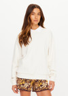 THE UPSIDE women's natural organic cotton Pascal Collared Crew offers a relaxed fit and features a collared neckline, scalloped edge detailing and ribbed trims. Made for lifestyle.