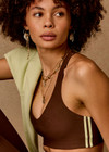 THE UPSIDE women's brown Daytona Jetta Racerback Sports Bra is designed for a soft and supportive fit and features a V neckline, contrast binding and removable cups. Made for yoga and pilates.