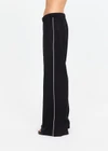 THE UPSIDE women's black lyocell linen blend Noir Elita Pant offers a true to size fit with a mid rise waist, contrast piping and slanted side seam pockets. Made for lifestyle.