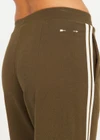 THE UPSIDE women's green Petra Flare Pant combines a true-to-size mid rise fit with side seam pockets, striped side tape and hem splits. Made for lifestyle.