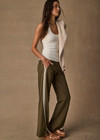 THE UPSIDE women's green Petra Flare Pant combines a true-to-size mid rise fit with side seam pockets, striped side tape and hem splits. Made for lifestyle.