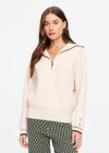 THE UPSIDE women's cream organic cotton Kairo Half Zip Knit is designed for a relaxed fit with a jacquard knit construction, oversized collar and contrast stripe detailing. Made for lifestyle.