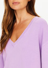 THE UPSIDE women's purple organic cotton Soul Lou V Neck Sweater offers an oversized fit with drop shoulders, ribbed trims and an embroidered logo detail. Made for lifestyle.