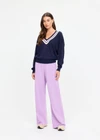 THE UPSIDE women's navy linen cotton blend Bonita V Neck Knit features a regular fit and dropped shoulders, striped neckline detailing and ribbed trims. Made for lifestyle.