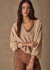THE UPSIDE women’s sand linen organic cotton Bonita V Neck Knit is designed for a regular fit and features a wide neckline, dropped shoulders and ribbed trims. Made for lifestyle.