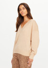 THE UPSIDE women’s sand linen organic cotton Bonita V Neck Knit is designed for a regular fit and features a wide neckline, dropped shoulders and ribbed trims. Made for lifestyle.