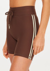 THE UPSIDE women's brown Daytona 5inch Spin Short offers a soft and supportive fit with a mid rise waist, contrast side binding and adjustable drawcord. Made for yoga and pilates.