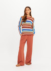 THE UPSIDE women's stripe Iza Milla Long Sleeve Knit Top is designed for a relaxed fit and features a semi sheer lightweight knit and multicolour stripe detailing. Made for lifestyle.