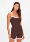 THE UPSIDE women's chocolate Rhythm Caleb Tank Top features a scooped front neckline with t-bar back and removable cups in our recycled rib fabrication. Made for yoga and pilates.