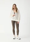 THE UPSIDE women's cream Hunter Knitted Jacket is designed for a relaxed fit and features an open knit construction and zipper opening. Made for lifestyle.
