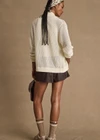 THE UPSIDE women's cream Hunter Knitted Jacket is designed for a relaxed fit and features an open knit construction and zipper opening. Made for lifestyle.