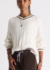 THE UPSIDE women's cream Millie V Neck Knit Sweater is designed for a relaxed fit and features a high v neckline and chocolate metallic stripes along cuffs, neckline and hem. Made for lifestyle.