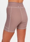 THE UPSIDE women's check Palacio 5inch Pocket Spin Short is mid-rise with no front seam and mushroom drawcord with aglets. Made for yoga and pilates.