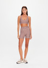THE UPSIDE women's check Palacio 5inch Pocket Spin Short is mid-rise with no front seam and mushroom drawcord with aglets. Made for yoga and pilates.