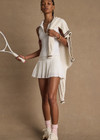 THE UPSIDE women’s white Game Karina Pleated Skirt features built-in inner shorts and pockets in recycled, soft-peached fabric. Made for tennis.