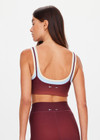 THE UPSIDE women's red recycled peached Maya Sal Double Layer Bra is mid coverage and features a scooped neckline, elasticated underbust and removable cups. Made for yoga and pilates.