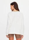 THE UPSIDE women's natural organic cotton Mali Long Sleeve Top is a relaxed fit and features a ribbed neckline in butter with navy piping. Made for lifestyle.