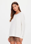 THE UPSIDE women's natural organic cotton Mali Long Sleeve Top is a relaxed fit and features a ribbed neckline in butter with navy piping. Made for lifestyle.