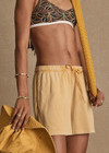 THE UPSIDE women's yellow Soho Dolci Short is designed for a high-rise, wide-leg silhouette with a elasticated waistband and front pockets, in soft brushed recycled cotton. Made for everyday leisure.