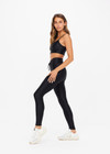 THE UPSIDE women's black Original Super Soft Yoga Pant is made from breathable, quick-drying and moisture-wicking with a 4-way stretch. It features a stretch drawcord waistband and a white arrow logo at the back.