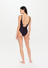 THE UPSIDE Paradox Pointe Bodysuit in Black is a sustainable mid coverage scooped neckline bodysuit with straight back straps, curved panelling detail and gold arrow branding at centre back. THE UPSIDE Paradox Pointe Bodysuit in Black is a sustainable mid coverage scooped neckline bodysuit with straight back straps, curved panelling detail and gold arrow branding at centre back.