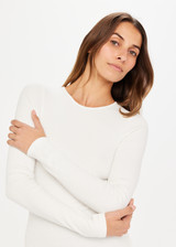 THE UPSIDE white Chrissy Long Sleeve top made from organic cotton is designed for a slim fit and features ribbed fabrication, crew neck and an embroidered tonal arrow logo.