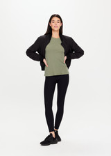 THE UPSIDE Mila Long Sleeve in Khaki is a relaxed long sleeve top in a stretch waffle texture. THE UPSIDE Mila Long Sleeve in Khaki is a relaxed long sleeve top in a stretch waffle texture.