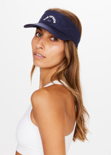 THE UPSIDE Raquette Sunny Visor in Navy is a recycled visor with our horseshoe tennis logo at front and Velcro strap closure.