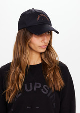 THE UPSIDE Camp Cove Soft Cap in Black is a sustainable soft retro fit cap with an adjustable Velcro strap and embroidered with our horseshoe logo at front.