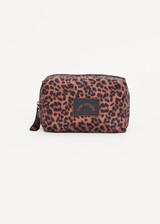 THE UPSIDE Biarritz Cosmetic Pouch in Leopard print is a recycled cosmetic pouch fully lined in our raspberry paisley print with a rubber branded patch on outer and chunky zipper with embroidered peace sign