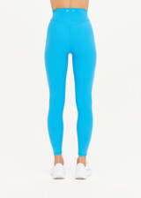 THE UPSIDE Peached 25inch High Midi Pant in Pool Blue is a recycled 25” midi length legging with a V shaped high-rise waistband and printed arrow logo at back.