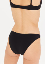 THE UPSIDE Camp Cove Moss Pant in Black is a recycled mid coverage bikini pant in our soft recycled ribbed fabrication.